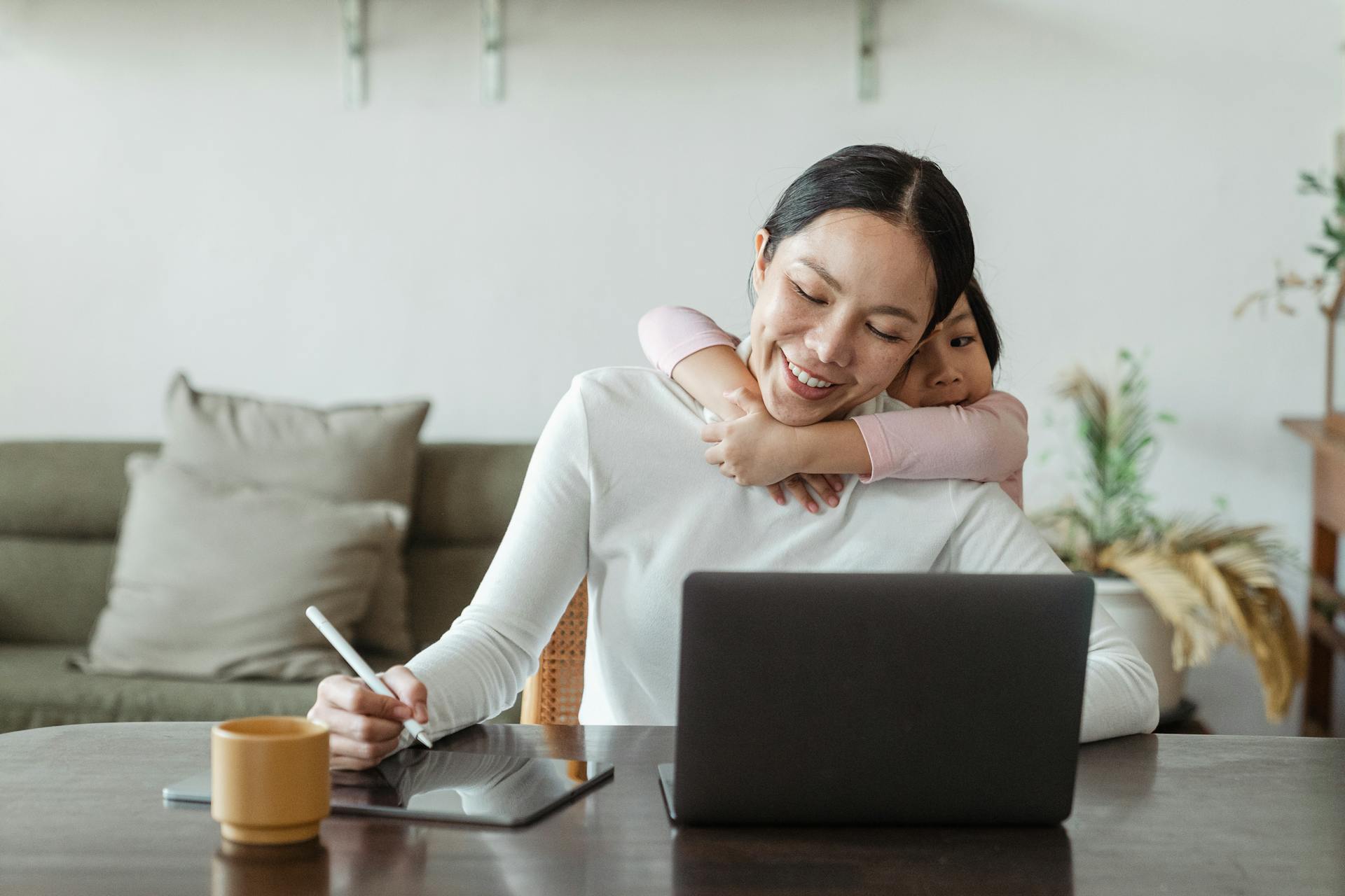 Child hugging mother from behind, symbolizing support on exam day
